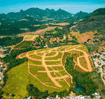 Imagem aérea do loteamento em andamento, estágio de terraplanagem, Columbia Park em Ibiraçu